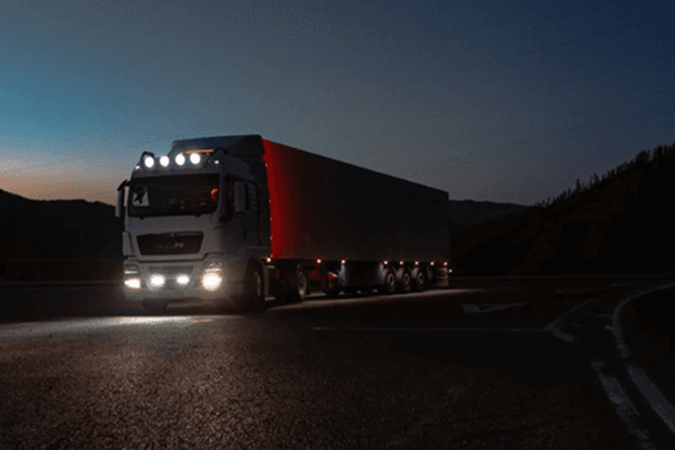 Truck driving at dusk